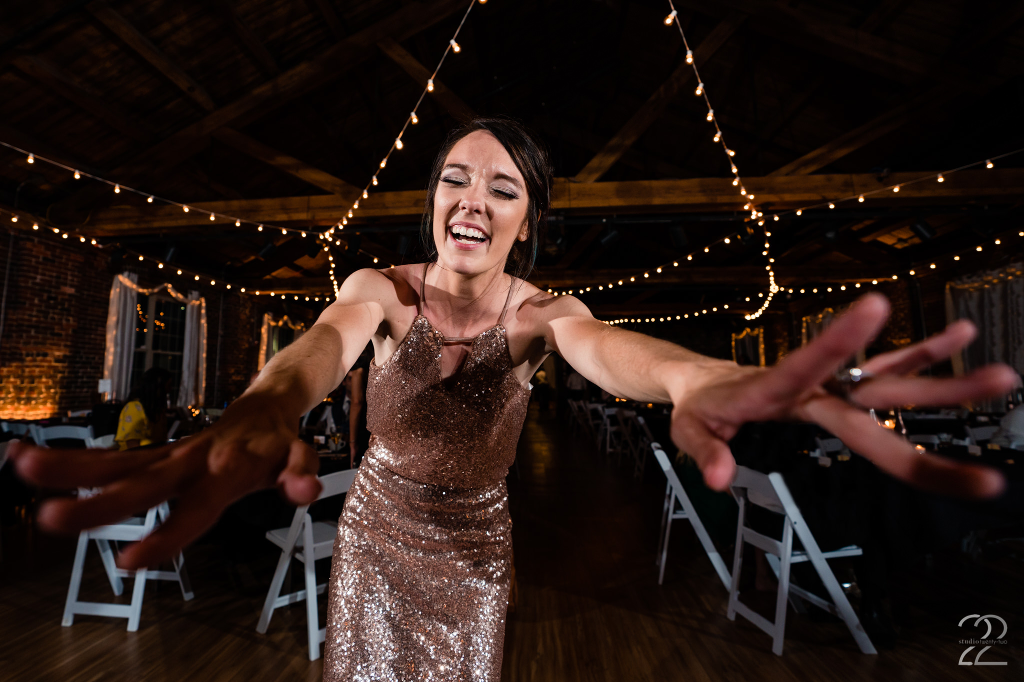  Megan at Studio 22 Photography loves to get in close to capture the action, but don’t worry we guarantee you will forget she is there and your guests will love watching her lay on the floor or climb on chairs. 